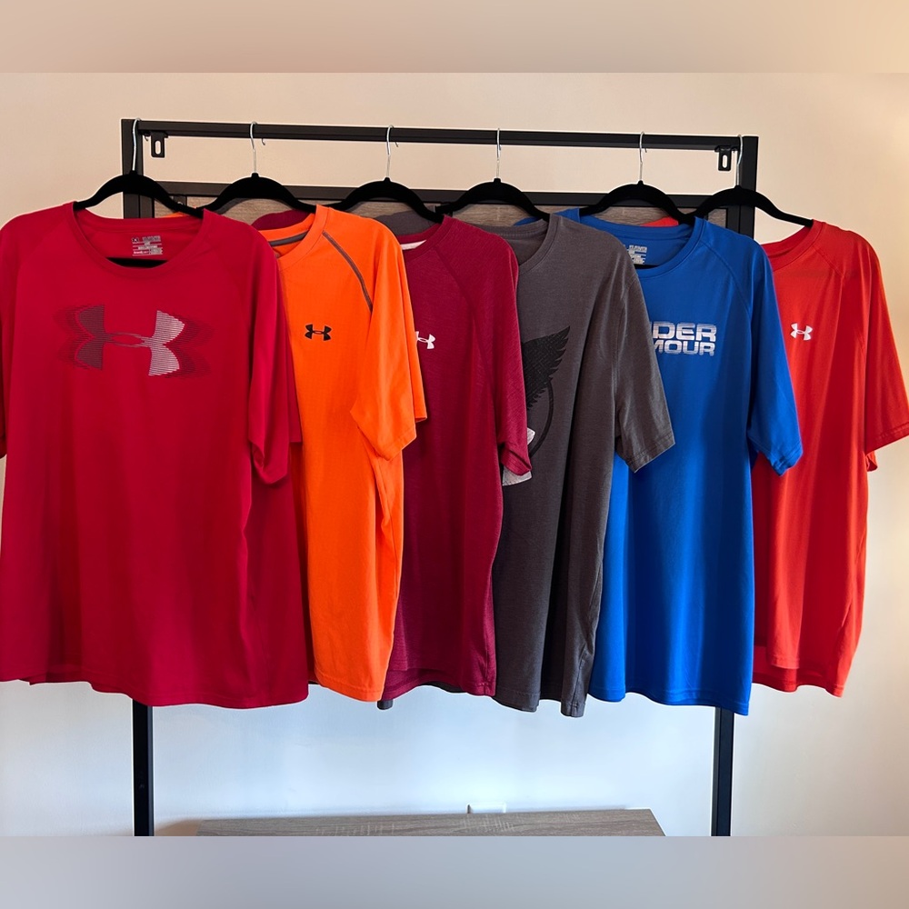 Six men’s Under Armour shirts size XXL